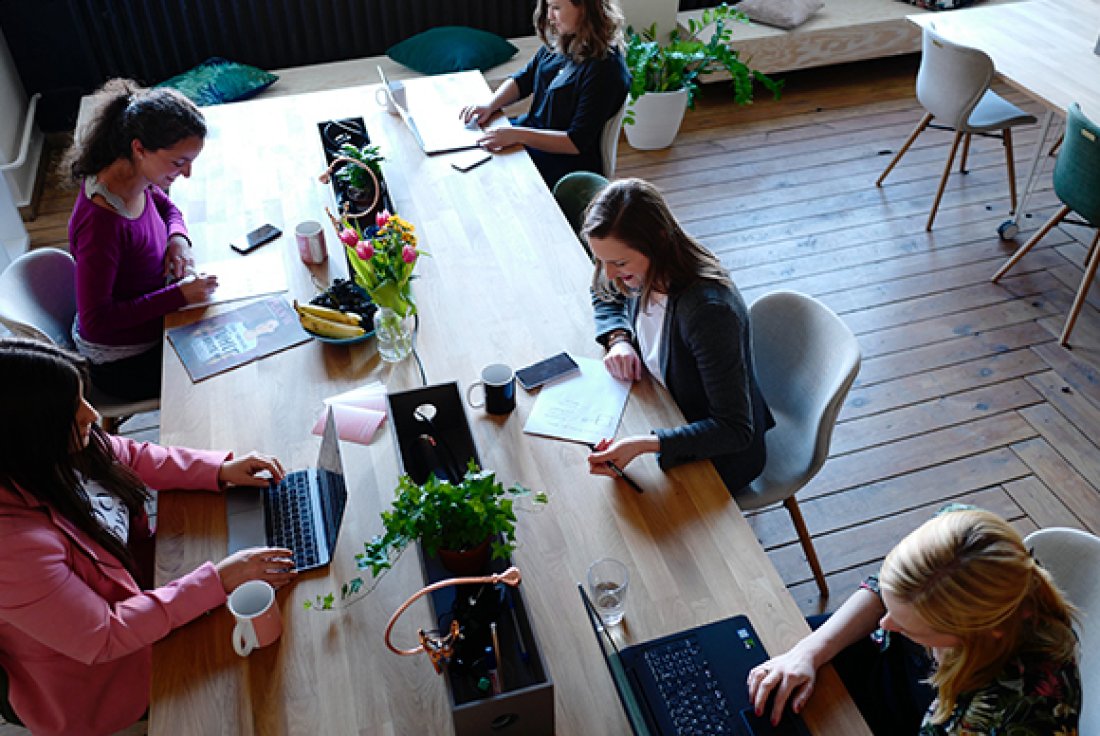 Marketers working together around a table